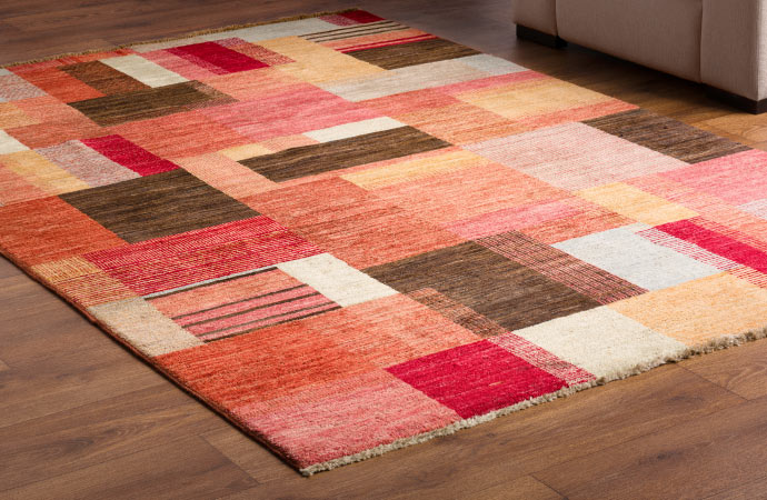A beautifully patterned decorative rug enhances the ambiance of the room
