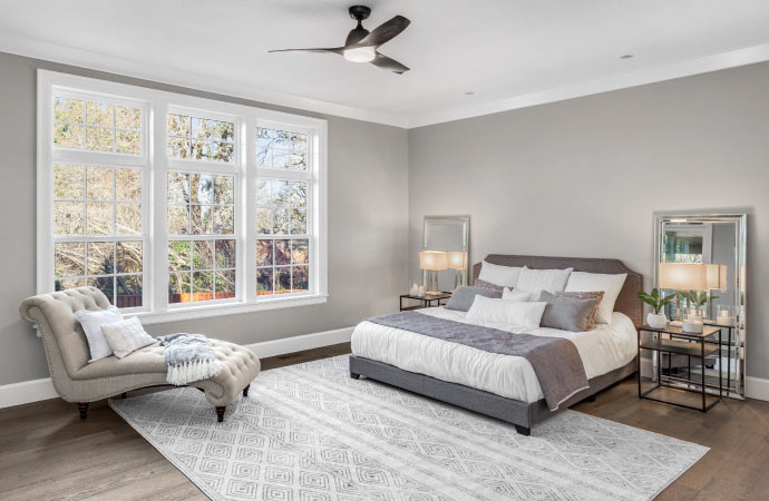 Soft color rug enhancing the cozy ambiance of a bedroom